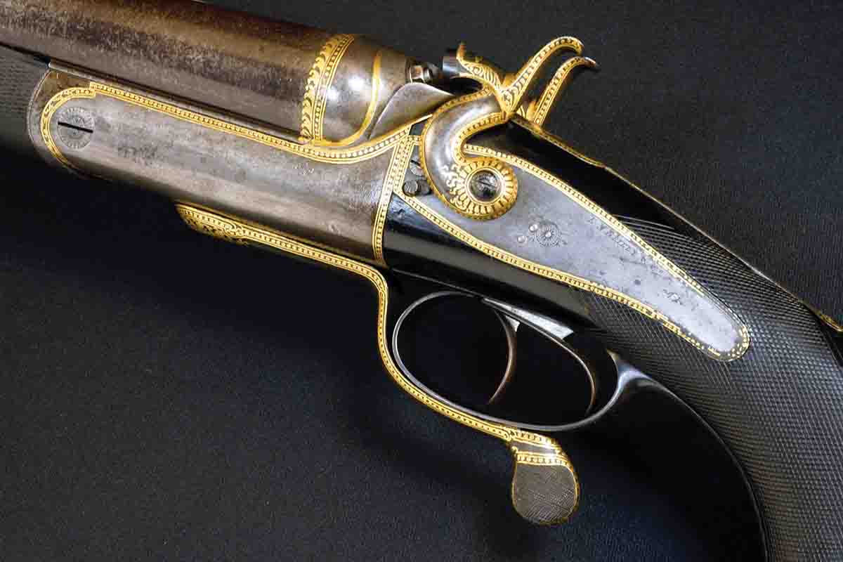 This E.M. Reilly 8-bore was made for an Indian Maharana, probably around 1900. For a maharaja rifle, this is almost  restrained. Oddly, there is little conventional engraving beyond the gold inlay, suggesting the work was carried out after the rifle was sent to India. It amounts to little more than a badge of office.